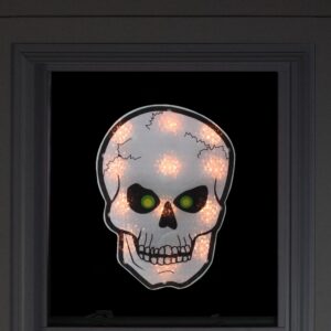 Northlight 12 in. Silver and Black Holographic Lighted Skull Halloween Window Silhouette Decoration
